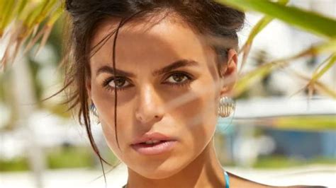 Brooks Nader poses topless for Sports Illustrated Swimsuit